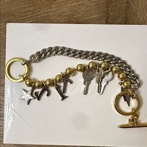 Elegant Gold and Silver Charm Bracelet